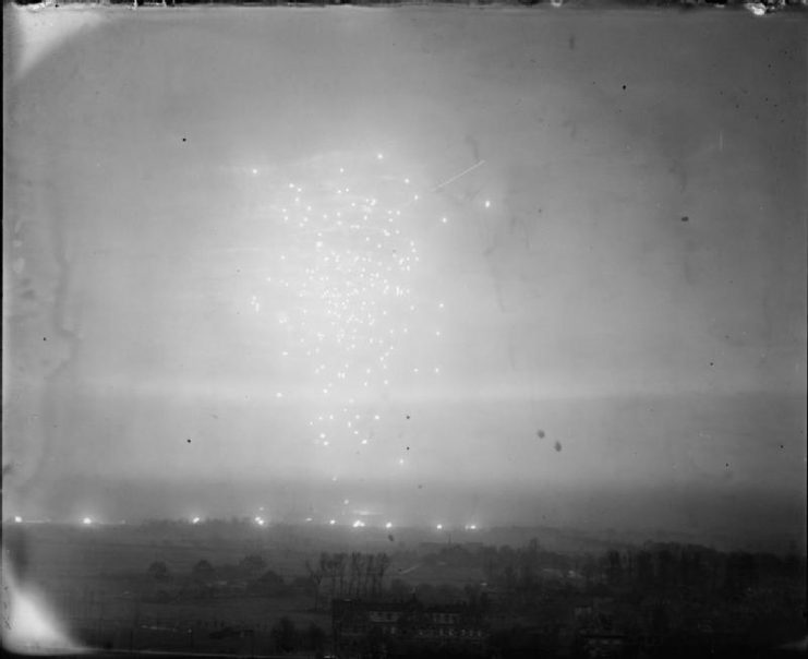 Bursts of German anti-aircraft fire fill the sky above Wesel, Germany, as 80 Avro Lancasters of No. 3 Group attack the town in preparation for the 21st Army Group’s assault across the River Rhine, (Operation VARSITY) on 24 March 1945.