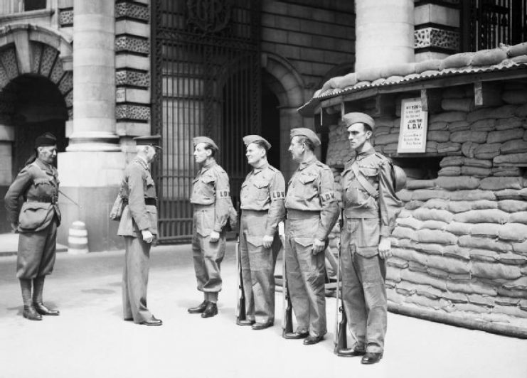 The first manned Local Defence Volunteers (LDV) post in central London. The men pictured are being inspected by General Nation and Major Hughman.
