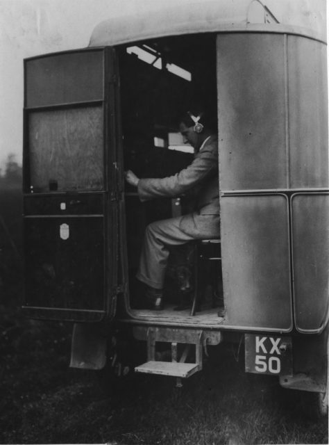 Jock Herd operates some of the radio receiver equipment in the Radio Research Section’s Morris van.