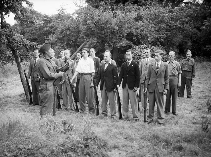 Local Defence Volunteer (LDV) recruits learning rifle drill at Buckhurst Hill, Essex, 1 July 1940.