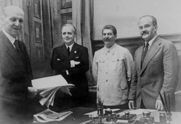 From left: Friedrich Gaus from Germany, Joachim von Ribbentrop, German Foreign Minister, Joseph Stalin, Soviet head of state and his Foreign Minister Vyacheslav Molotov pose 23 August 1939 in Kremlin in Moscow after signing the Soviet-German Non-Aggression Pact, making the outbreak of a European war virtually inevitable. After the ceremony, Stalin proposed a toast: "I know how much the German people love their Fuehrer" (Hitler), he said. "I should therefore like to drink to his health".
