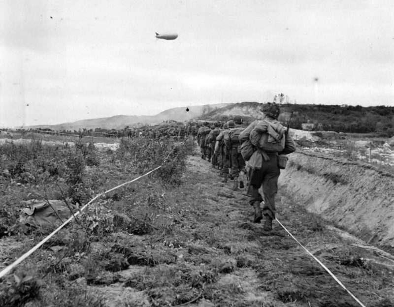 US_Infantrymen_Advance_thru_German_Minefield_in_Normandy_1944