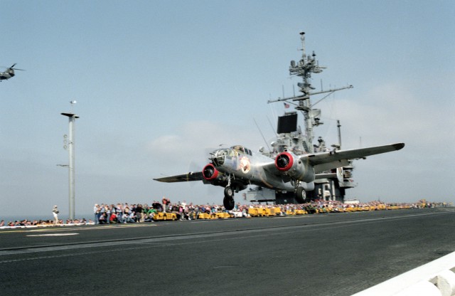 The restored World War II B-25 Mitchell bomber aircraft In The Mood takes off from the flight deck of the aircraft carrier USS Ranger (CV-61). The B-25 is taking part in a re-enactment of Doolittle's Raid of April 18, 1942, during which 16 B-25s were launched from the aircraft carrier USS Hornet (CV-8) in the first attack on the Japanese mainland.