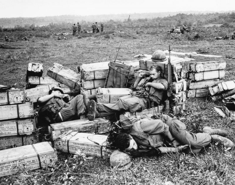 Three American marines sleep atop ammunition boxes during a pause in the fighting at Gio Linh on April 2, 1967, just south of the demilitarized zone in Vietnam. (AP Photo)