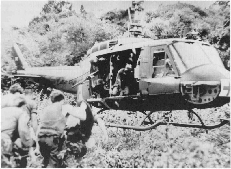 Lieutenant Tuell and Capt. Howard Elliot pilot a helicopter in Dustoff operation, May 1970