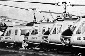 Air America Bell 205s being evacuated aboard USS Hancock, in 1975. (Wikipedia)