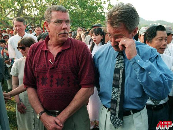 Thompson (left) and Colburne (right) attending the 30th anniversary of the My Lai Massacre at the monument and museum in Vietnam