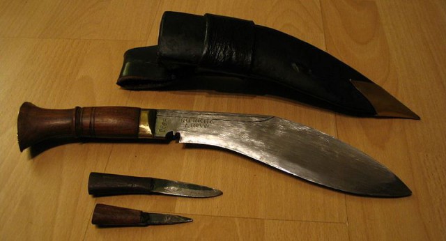 https://en.wikipedia.org/wiki/File:Kukri,_karda_%26_chakmak.jpg The Kukri is the bigger knife, which is both a utility tool and weapon used throughout Nepal and other parts of Asia. They come with two smaller knives called the chakmak and karda, used for burnishing the knife and for skinning purposes, respectively.