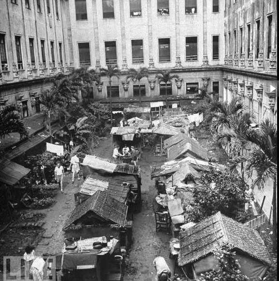 https://en.wikipedia.org/wiki/File:Shanties,_STIC.jpg Japanese Santo Tomas Internment Center, Manila (1945). Conditions were so cramped, many built their own shanties outside