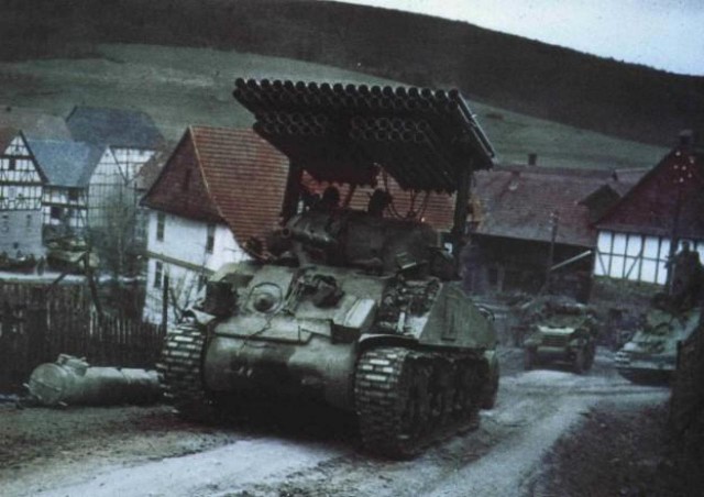 Sherman With T34 Launcher advancing in Germany - 1945