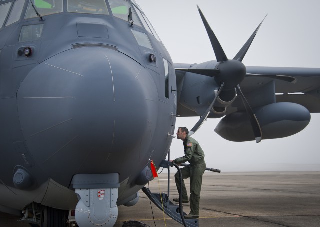 Capt. Steve Visalli, a flight test engineer with the 413th Flight Test Squadron, boards the newly created AC-130J Ghostrider in anticipation of its first official sortie Jan. 31 at Eglin Air Force Base, Fla. The Air Force Special Operations Command MC-130J arrived at Eglin in January 2013 to begin the modification process for the AC-130J, whose primary mission is close air support, air interdiction and armed reconnaissance. A total of 32 MC-130J prototypes will be modified as part of a $2.4 billion AC-130J program to grow the future fleet. (U.S. Air Force photo/Chrissy Cuttita)