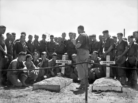 Men of the 2/48th Battalion gathered around Derrick's grave during his funeral.