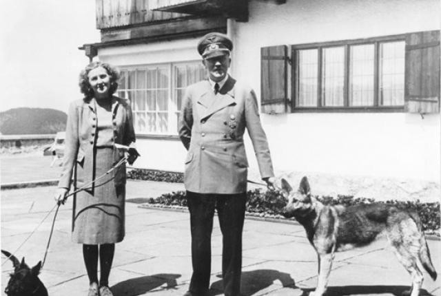 Eva Braun and Adolf Hitler, with their dogs