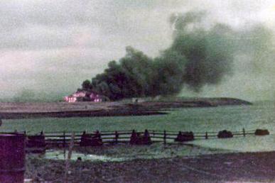School House on Fire during the Battle of Goose Green in 1982 via commons.wikimedia.org