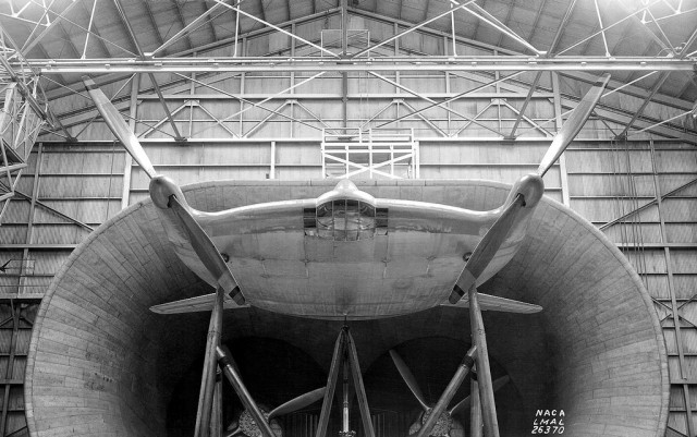 Edited NACA image of of a Vought V-173 ("Flying Flapjack") undergoing testing in a wind tunnel.