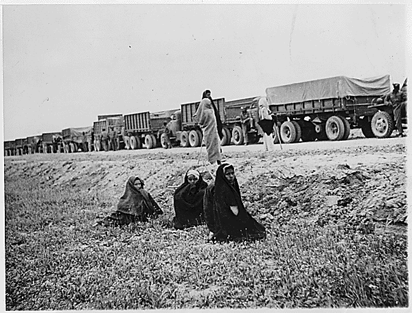 Iranian women watching an Allied convoy