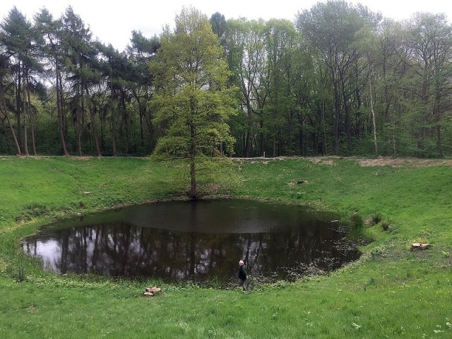 A crater from the Battle of Messines, 1917 (Wikipedia)