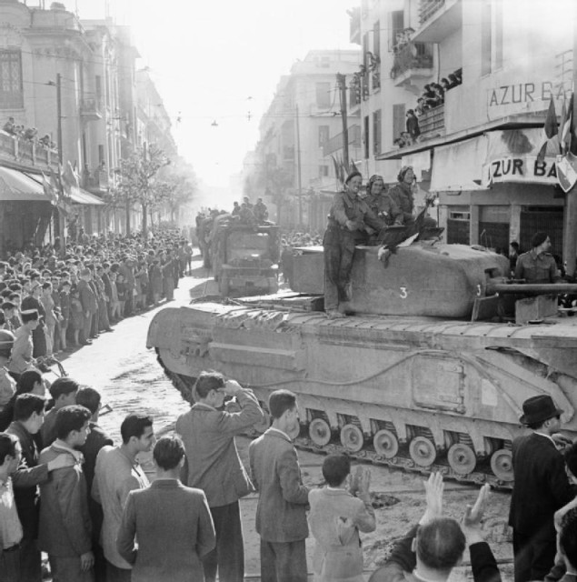 Churchill tank moves through Tunis during the liberation, May 8th, 1943