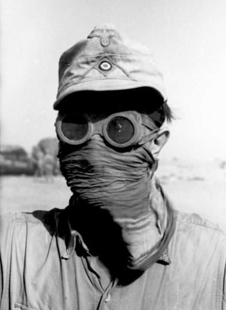 Afrikakorps Soldier wearing goggles and face covering to protect against sand storms. Photo Credit.