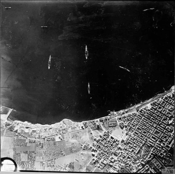 Aerial-reconnaissance vertical of Italian naval vessels moored in the outer harbour at Taranto, Italy.