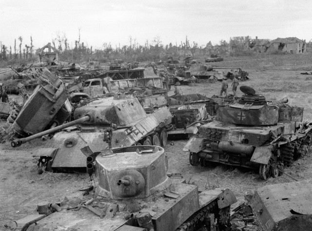 The wreckage of British and German AFVs destroyed in the battles around Caen, 1944. A number of wrecked vehicles at a tank graveyard near Villons-Les-Bruissons. The heavy fighting in Normandy after D-Day so depleted the 3rd and 4th County of London Yeomanry's tank strength that they were merged on 1 August 1944, at Carpiquet. (NAM. 1975-03-63-18-196)