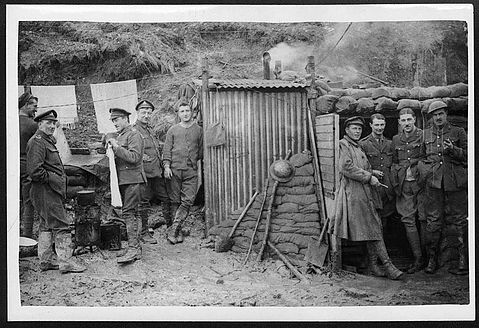 'Artillerymen outside dugouts.'