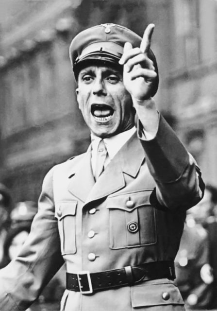 Goebbels giving a speech in Berlin in 1934. This hand gesture was used while delivering a warning or threat. Photo Credit.