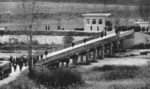 The Americans being released one at a time on the Bridge of No Return to South Korea