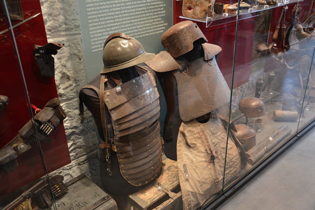 Italian infantry armor and the Farina helmet (on the right); Photo Source