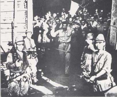 The final surrender of the Malinta tunnels. American troops had holed up the tunnel system beneath Malinta Hill, and held out until the very end.