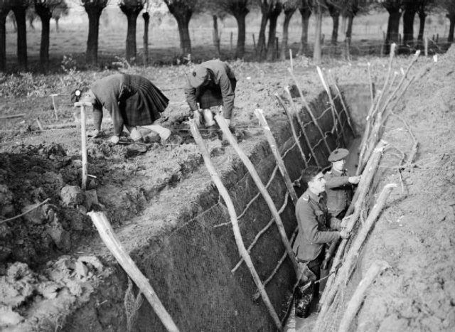 More details Men of the 1st Battalion, Queen's Own Cameron Highlanders digging trenches at Aix, France, November 1939.