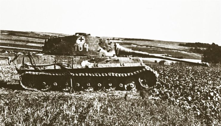 Tank 104 at Aux Marais in 1944, showing damage on the hull underneath the ‘4’.