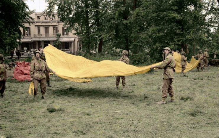 1st Airborne soldiers use parachutes to signal to Allied supply aircraft from the grounds of 1st Airborne Division’s HQ at the Hartenstein Hotel in Oosterbeek, Arnhem, 23 September 1944. Paul Reynolds / mediadrumworld.com