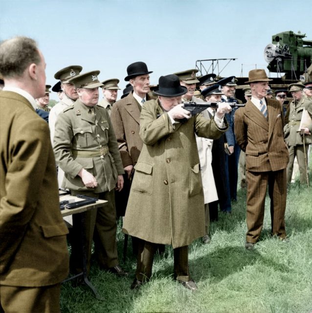 Winston Churchill takes aim with a Sten gun during a visit to the Royal Artillery experimental station at Shoeburyness in Essex, 13 June 1941. Paul Reynolds / mediadrumworld.com