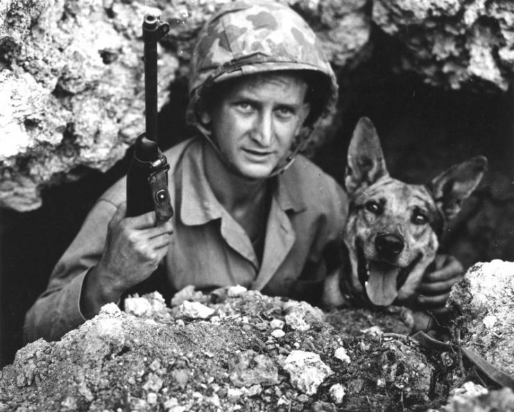 US Marine Private John Drugan and his war dog, Okinawa, Japan, May 1945.
