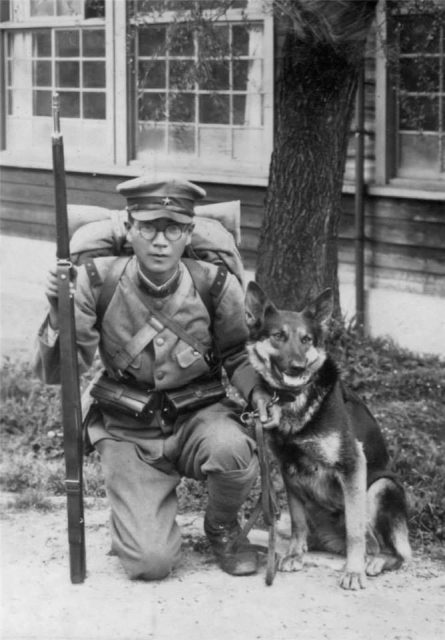 Japanese soldier with a dog, circa 1939
