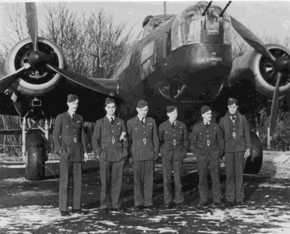 A Wellington bomber at Mildenhall. Ron Morison is first from the left.