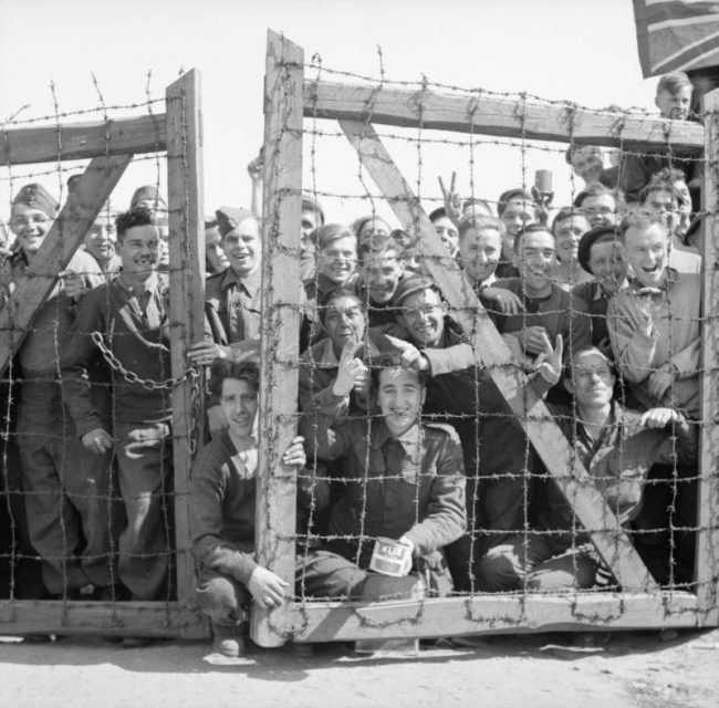 POWs welcome their liberators. Fallingbostel, Germany. 1945.