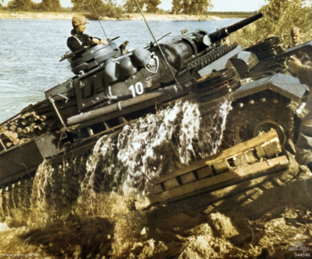 A German Panzerkampfwagen III Ausf J medium tank negotiating a river crossing in the Soviet Union during WWII.
