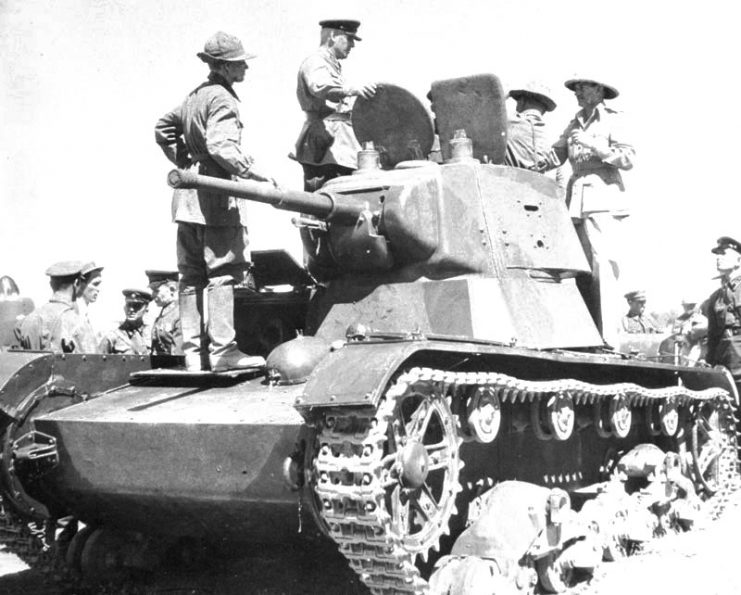British soldiers curiously inspecting a T-26 battle tank of the Soviet occupation forces after their rendezvous in Iran. Sunday, August 31, 1941.