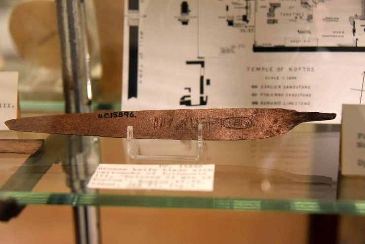 Bronze knife blade inscribed with cartouche of Thutmose III, “Beloved of Min of Koptos”. 18th Dynasty. Probably foundation deposit no.1, Temple of Min, Koptos (Qift), Egypt. The Petrie Museum of Egyptian Archaeology, London. With thanks to the Petrie Museum of Egyptian Archaeology, UCL.Photo: Neuroforever CC BY-SA 4.0