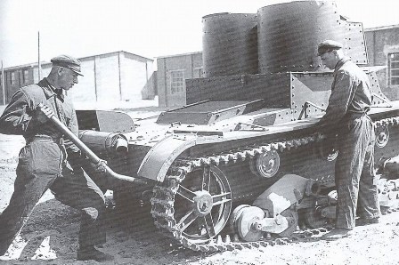 Maintenance of the T-26 mod. 1931 (with riveted hull and turrets). This tank was produced in the first half of 1932—the exhaust silencer is mounted with two clamps and the cover over the air outlet window. The Moscow Military District. Mid-1934.