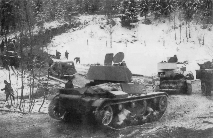Soviet T-26 light tanks and GAZ-A trucks of the Soviet 7th Army during its advance on the Karelian Isthmus, December 2, 1939.