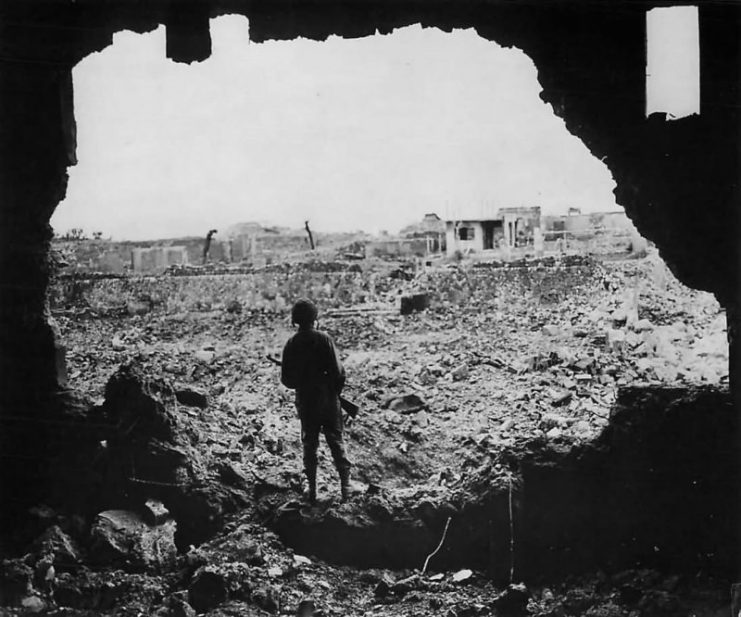 Marine Rifleman Looks over Ruins of Naha Okinawa
