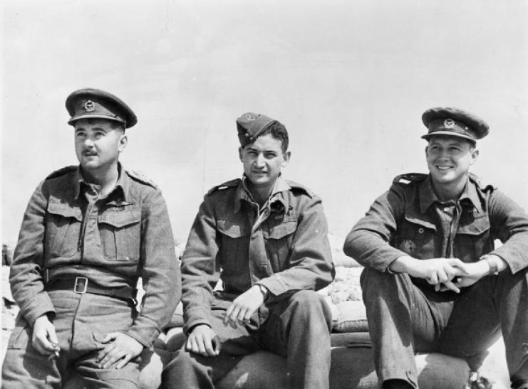 Squadron commander Major John “Jack” Frost (centre) was the highest scoring ace in the SAAF during World War II.5 Squadron SAAF March/April 1942