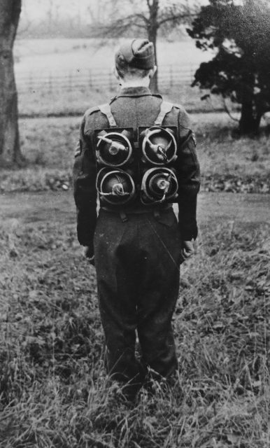 Limpet mines being carried on a harness on the back of a soldier.