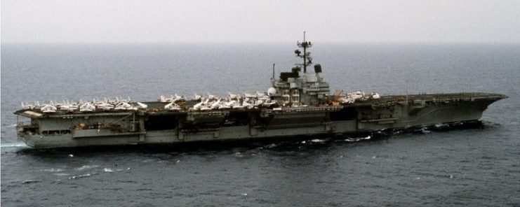 An aerial starboard beam view of the aircraft carrier USS FORRESTAL (CV-59) underway.