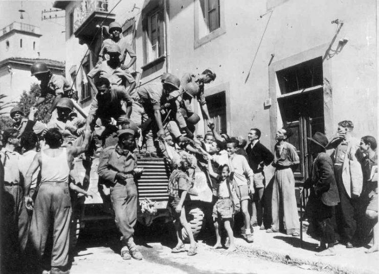 Brazilian soldiers greet Italian civilians in the city of Massarosa, September 1944.