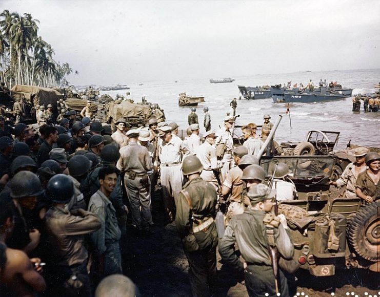 General Douglas MacArthur (center), accompanied by Lieutenant Generals George C. Kenney and Richard K. Sutherland and Major General Verne D. Mudge, inspecting the beachhead on Leyte Island, October 20, 1944.