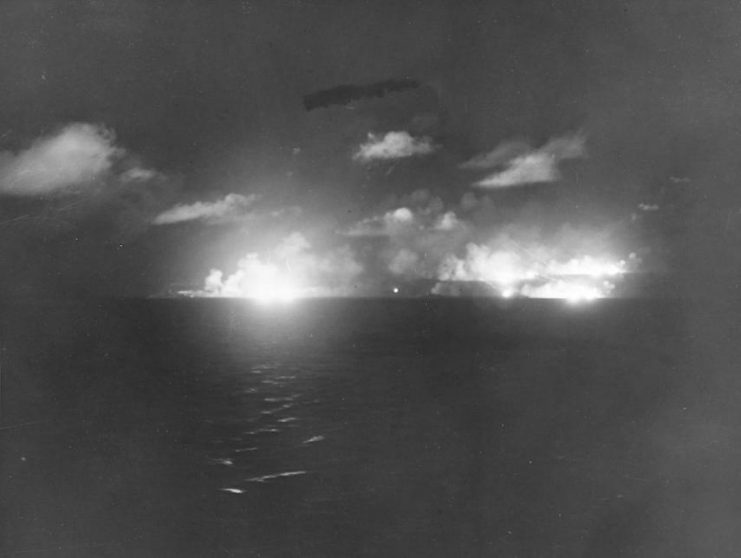 U.S. cruisers firing on Japanese ships during the Battle of Surigao Strait, 25 October 1944: USS Louisville (CA-28), USS Portland (CA-33), USS Minneapolis (CA-36), USS Denver (CL-58), and USS Columbia (CL-56).